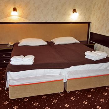 Photo of double bed with bedside tables from series of furniture for hotels Karolina