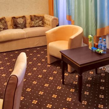 Photo of the lobby of hotel room with coffee table from series of furniture for hotels Karolina