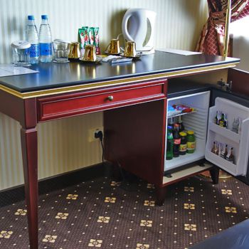Photo of open dressing table with minibar from series of furniture for hotels Raffaella