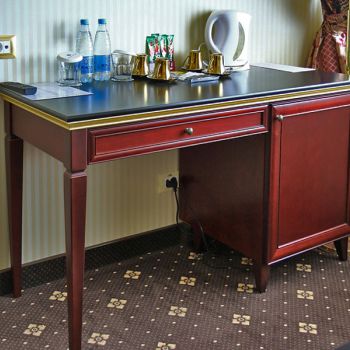 Photo of dressing table with minibar by the window from series of furniture for hotels Raffaella