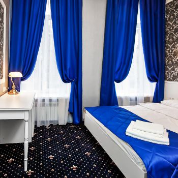 Photo of double bed and dressing table with minibar from series of furniture for hotels Verona