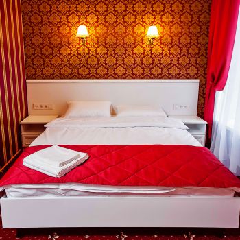 Photo of double bed with bedside tables from series of furniture for hotels Verona