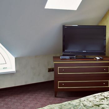 Photo of a TV cabinet in a room from a series of furniture for hotels Vettriano