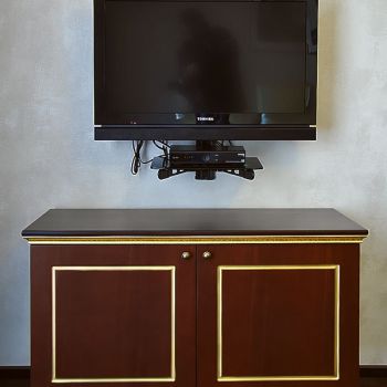 Photo of chest of drawers with minibar in hotel furniture Vettriano
