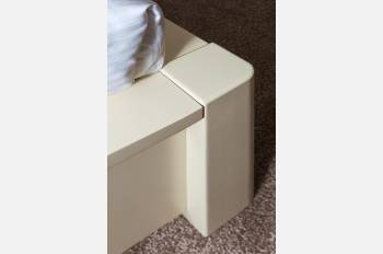 Photo of the legs of a queen-size bed "Karina" tinted in ivory with gold